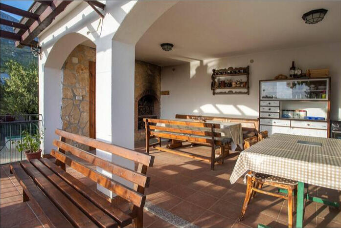 Fireplace-equipped outdoor kitchen